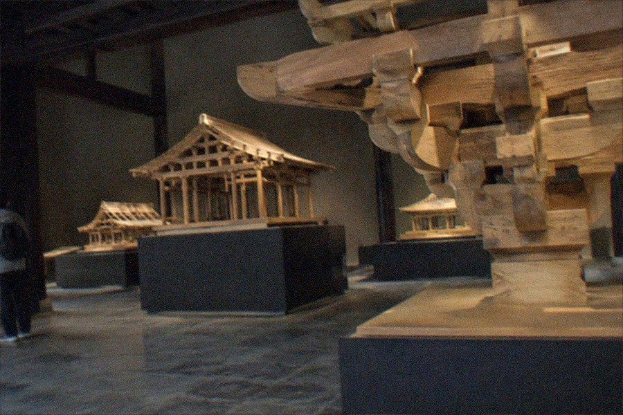 Walled courtyard of the Temple of Agriculture complex housing the Beijing Ancient Architecture Museum, with timber halls under grey tiled roofs
