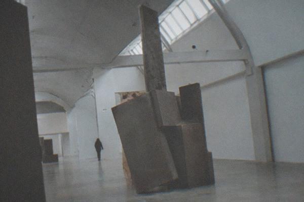 Contemporary art gallery interior with large canvases on white walls