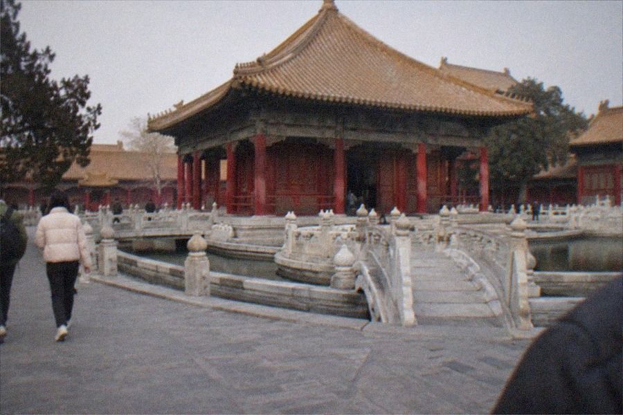 Rows of tall stone steles standing in a courtyard at the Confucius Temple and Imperial College Museum in Beijing