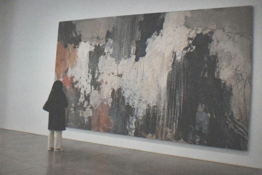 The tall brick facade and entrance canopy of the UCCA Center for Contemporary Art inside the 798 Art Zone